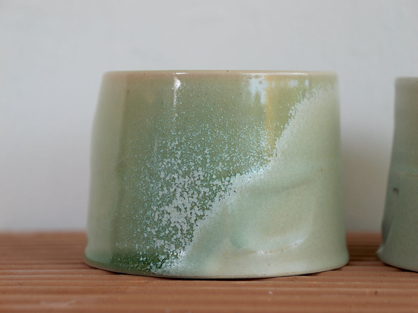 Set of two crystallised glossy green whiskey cups